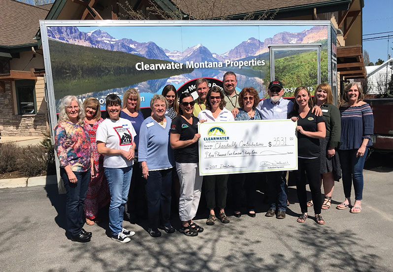 Clearwater's moving van and a donation check